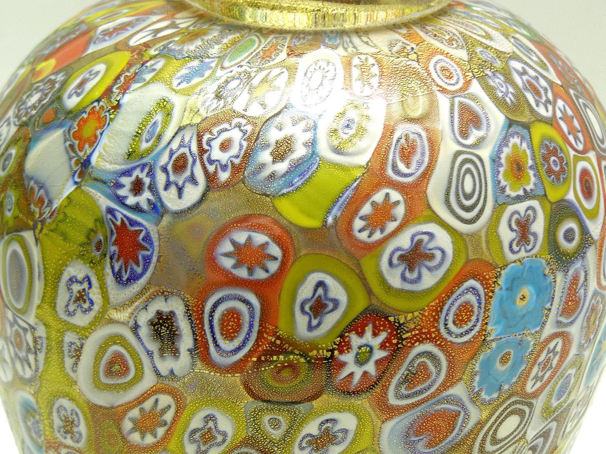 Gorgeous handblown Murano glass urn vase by Gambaro & Poggi with raised millefiori design and a fused rim filled with gold leaf flecking.