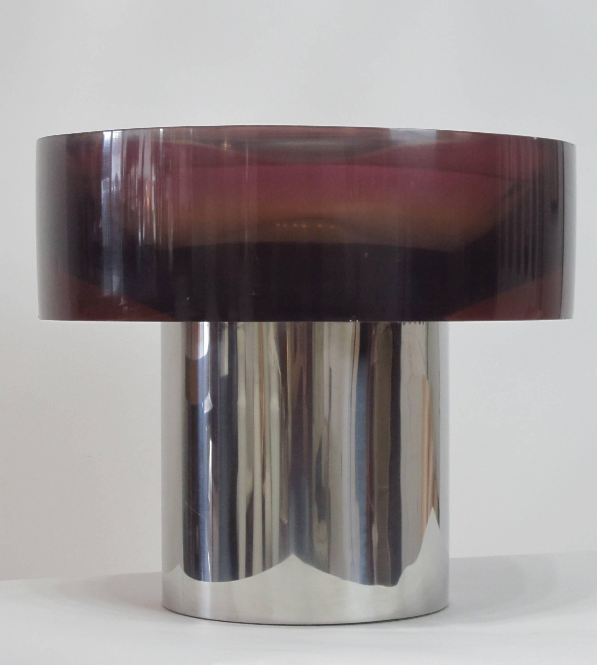 Wonderful two-part sculpture with purple acrylic bowl resting on a polished steel cylindrical base. There are small chips and visible wear on the rim of the solid and heavy bowl while the steel base in is great condition. Purchased in New York City