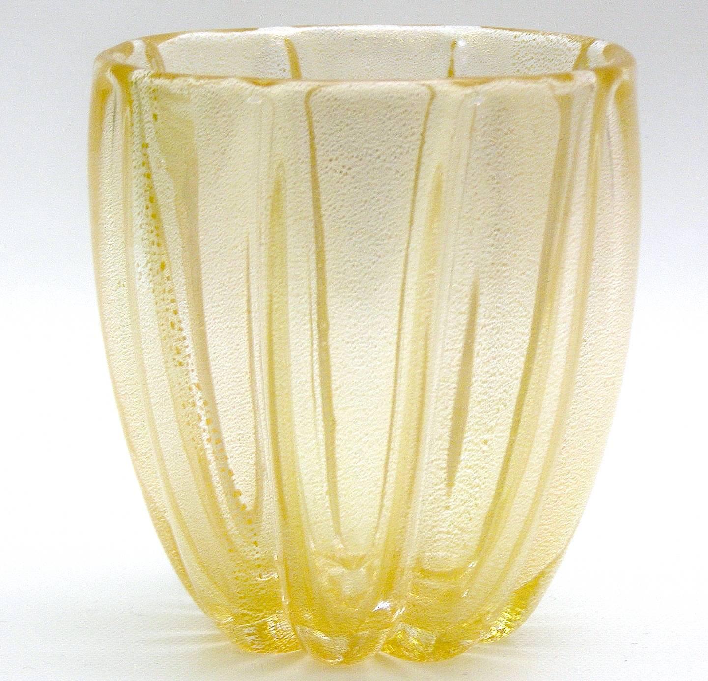 Beautiful handblown fluted Murano glass vessel by Barovier e Toso. Filled with aventurine (gold leaf flecking) producing this splendid golden color.