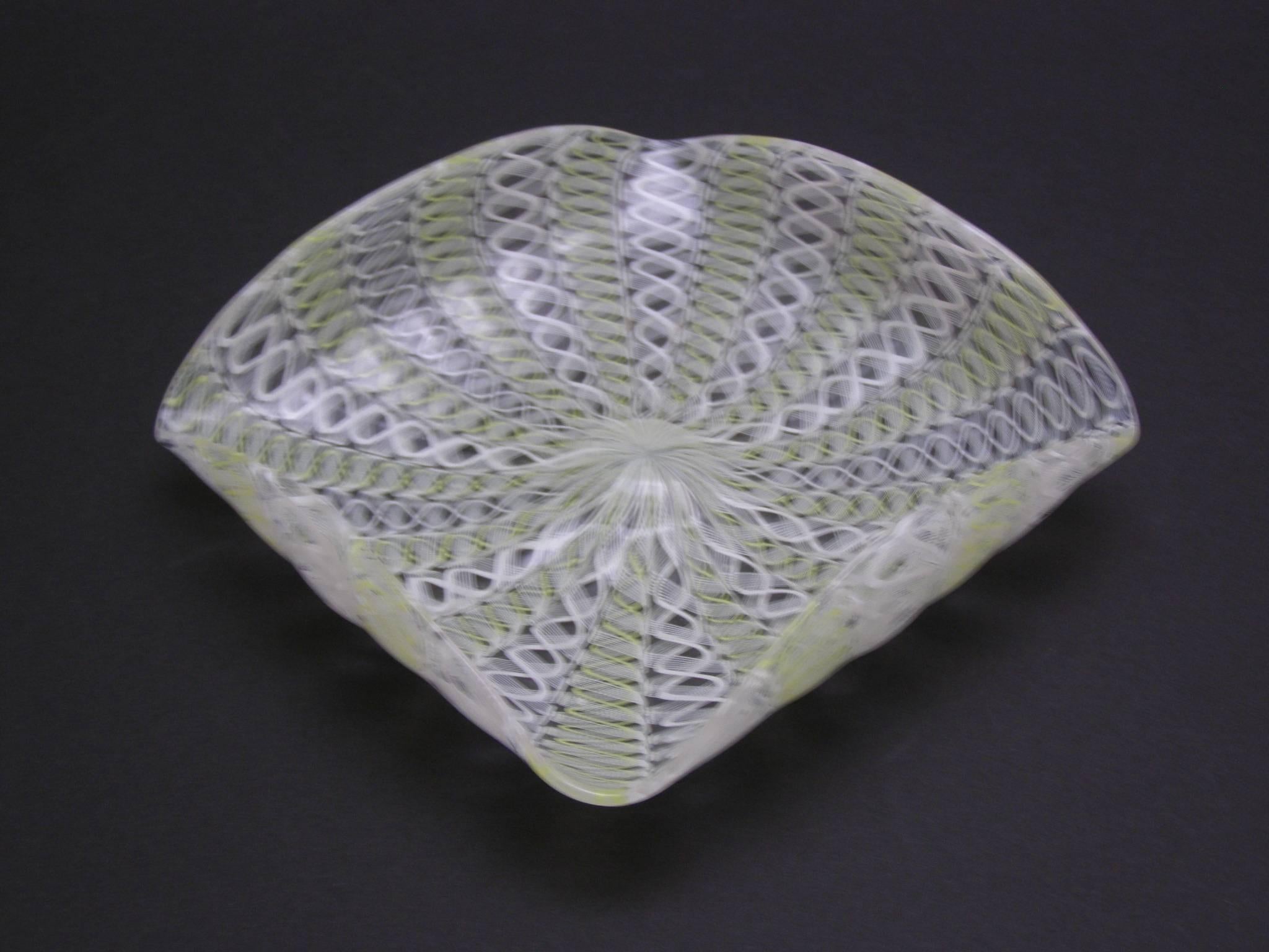 Beautiful handblown Murano glass dish with yellow and white latticino pattern. Turned up sides add just the right dimension to this very pretty dish. Useful as a catchall and as a display.