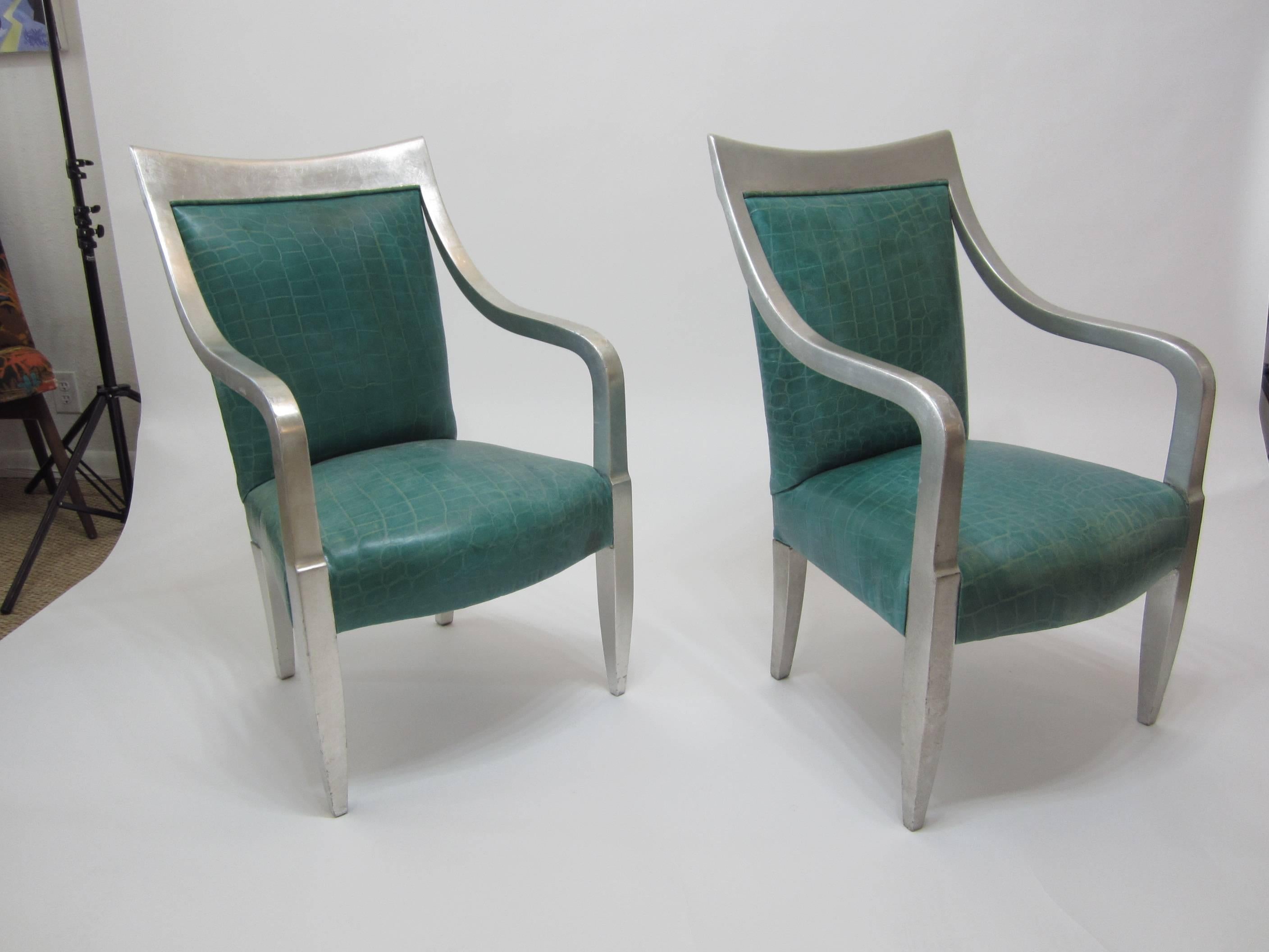 Beautiful pair of silver leaf wood frame armchairs in aqua crocodile embossed leather. With swooping open arm frames and turquoise leather, these chairs have large character and make a great statement! Sold as a pair in original great condition with