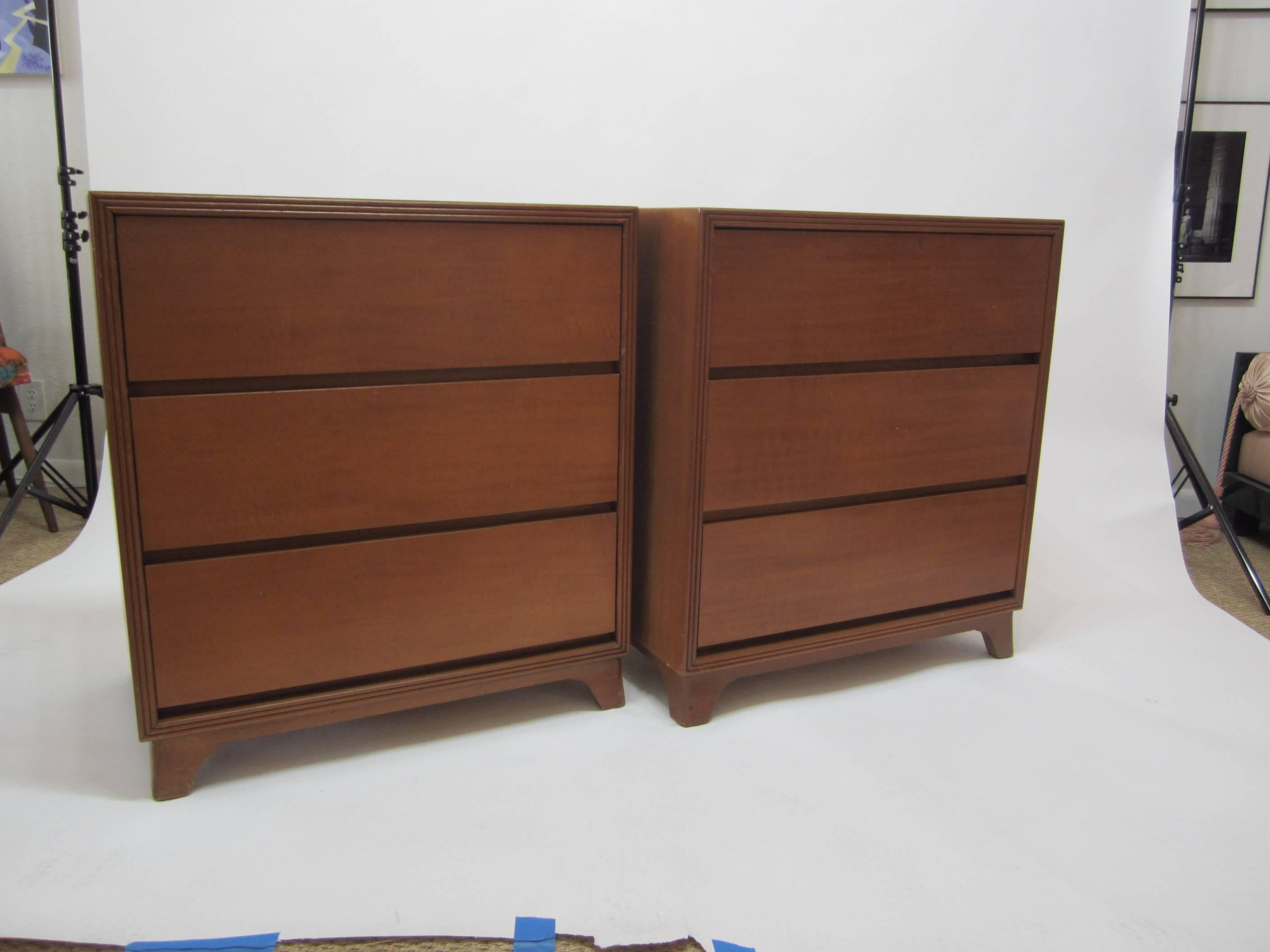 Wonderful pair of flared leg chests of drawers or bachelors chests each with three drawers. Clean lines with ribbed molding surrounding exterior front. Drawers open by pulling from bottom keeping the lines very clean with no pulls. Original