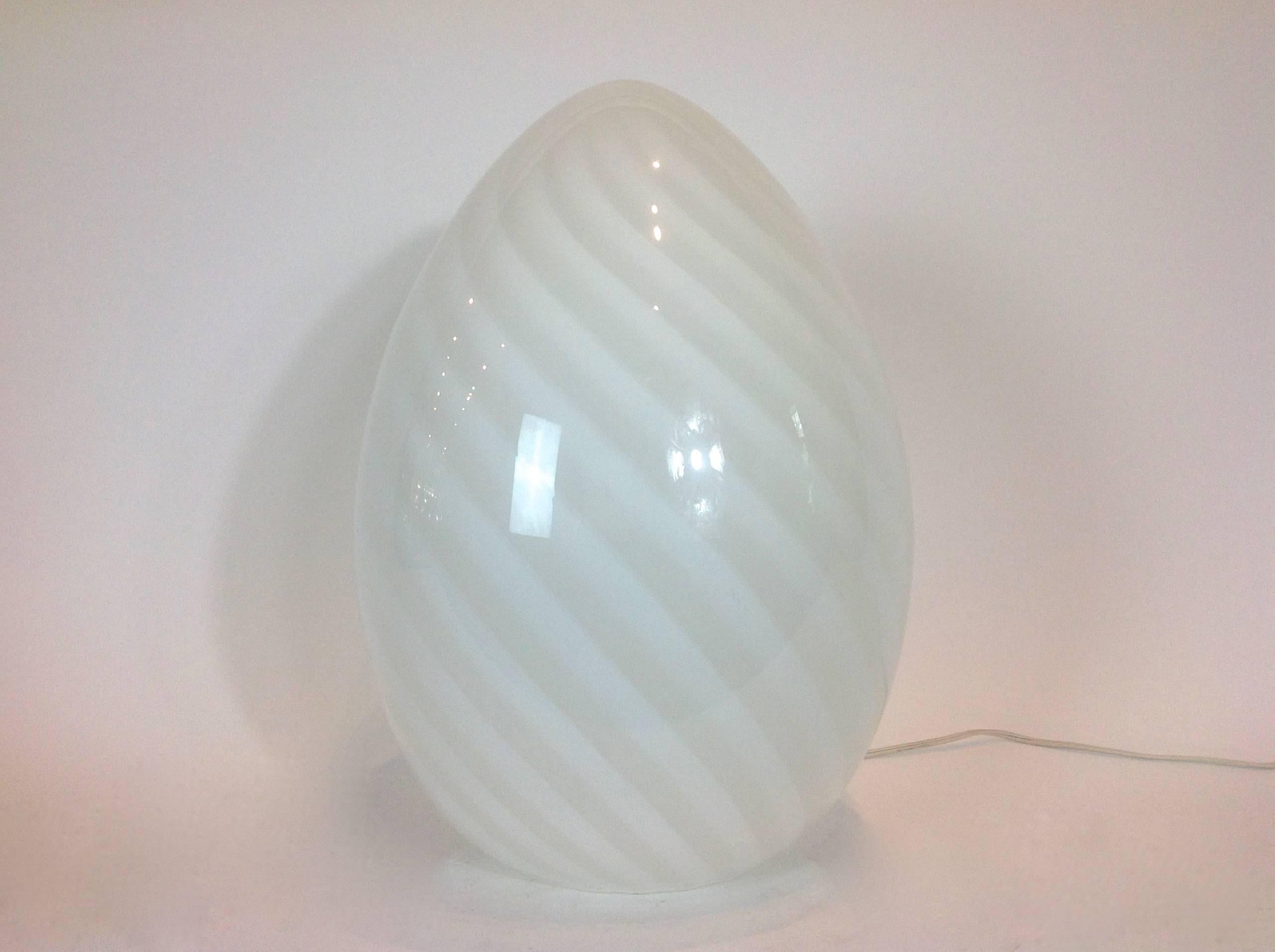 Fantastic all-glass handblown egg lamp with swirl pattern. Beautiful ambient light glowing from within.