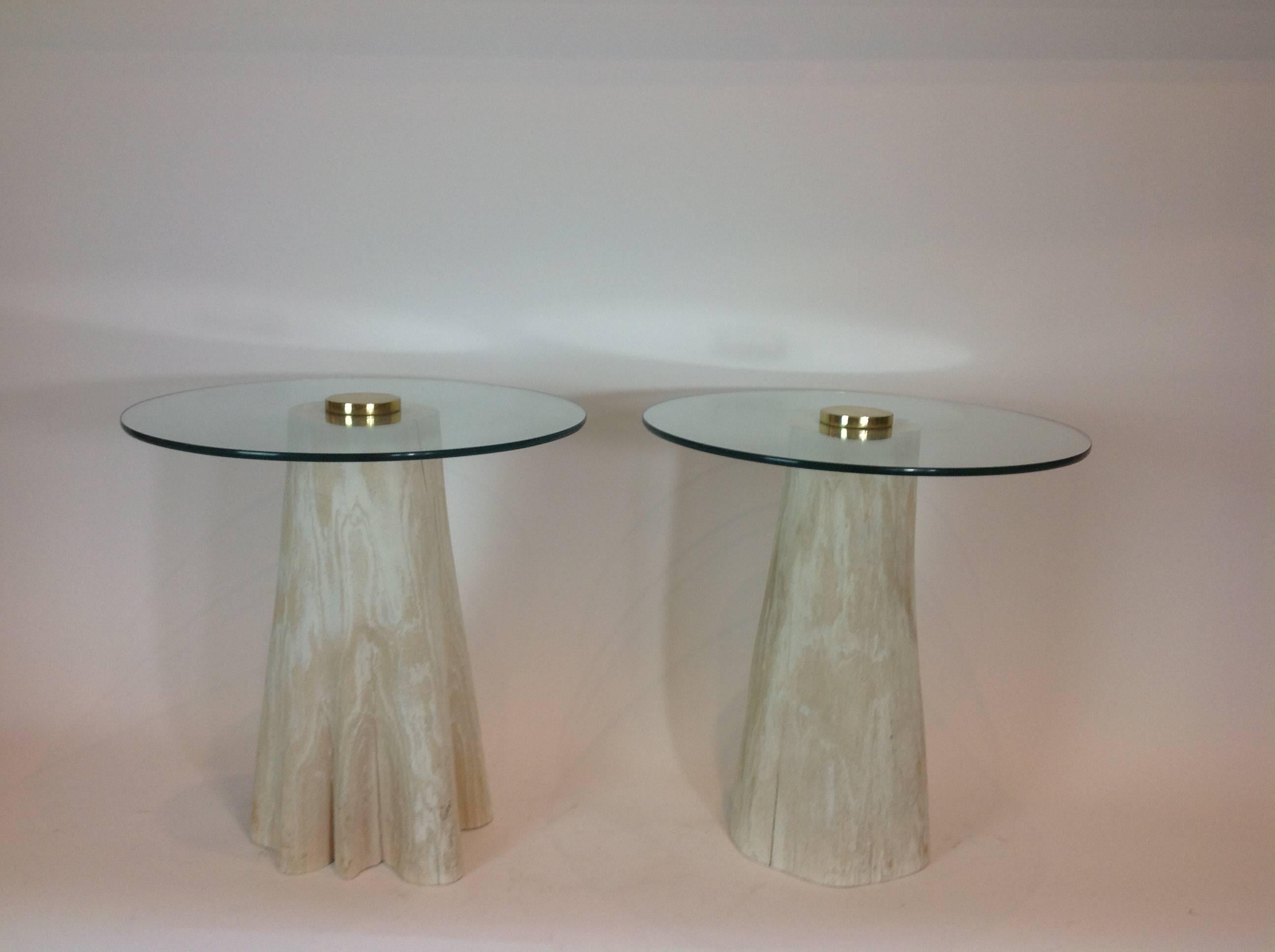 Wonderful pair of side tables made of natural cerused tree trunks with round glass tops with brass centre cap. Natural occurrence of separations in wood trunks.