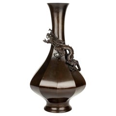 A Japanese bronze vase with Ryū dragon in relief, signed Maruki Sei