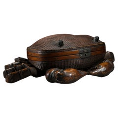 A woven bamboo and wood box shaped like a crab