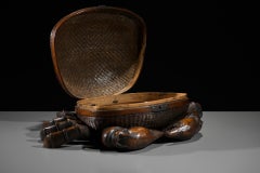 A woven bamboo and wood box shaped like a crab