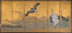 A pair of six-panel folding screens from the Kanō school depicting red-crowned c