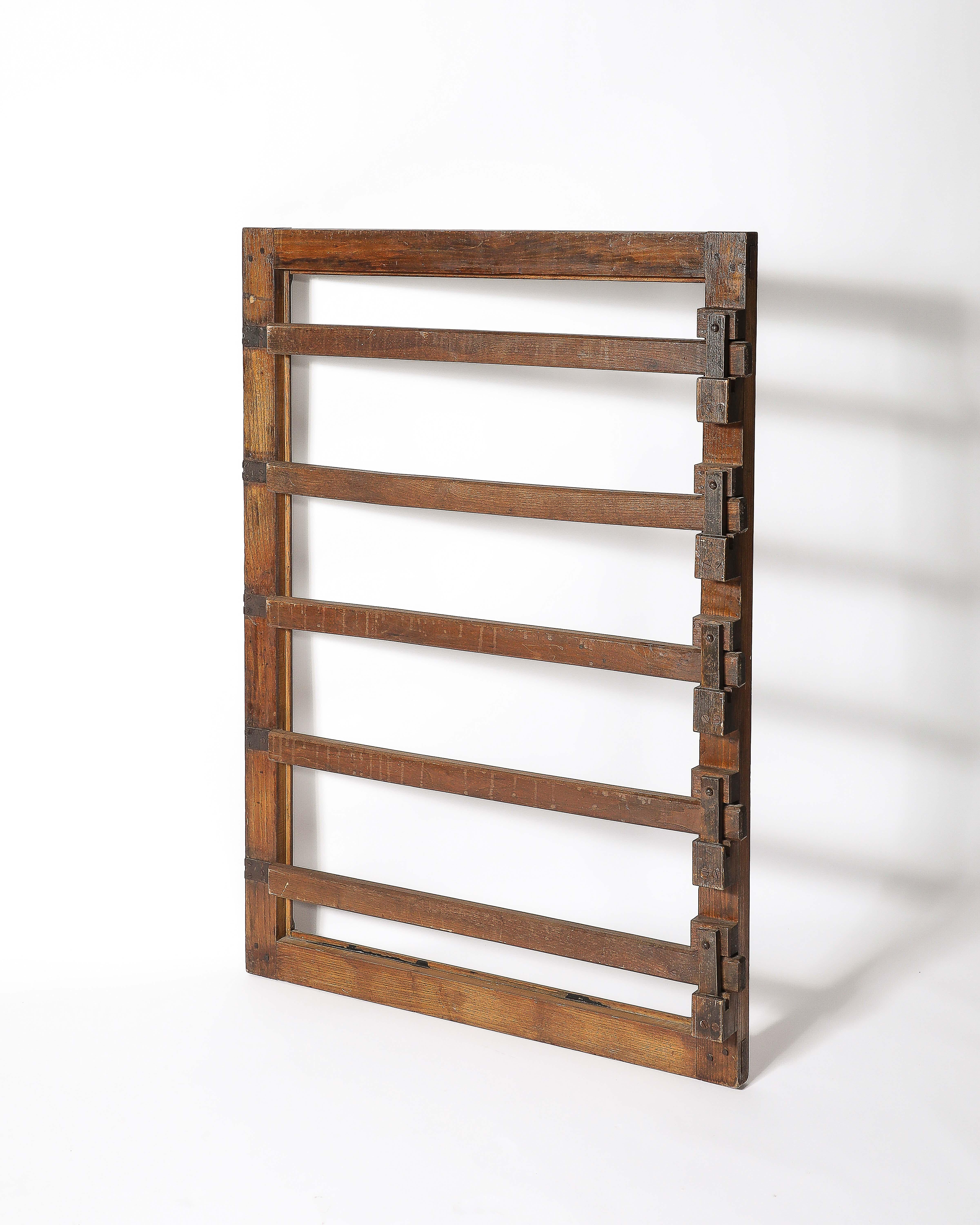 Cool, rustic remnant, possibly a drying rack or specific gate. There are D hooks on the back so this can be hung like an artwork. Purchased from the famed antiques dealer Amy Perlin.