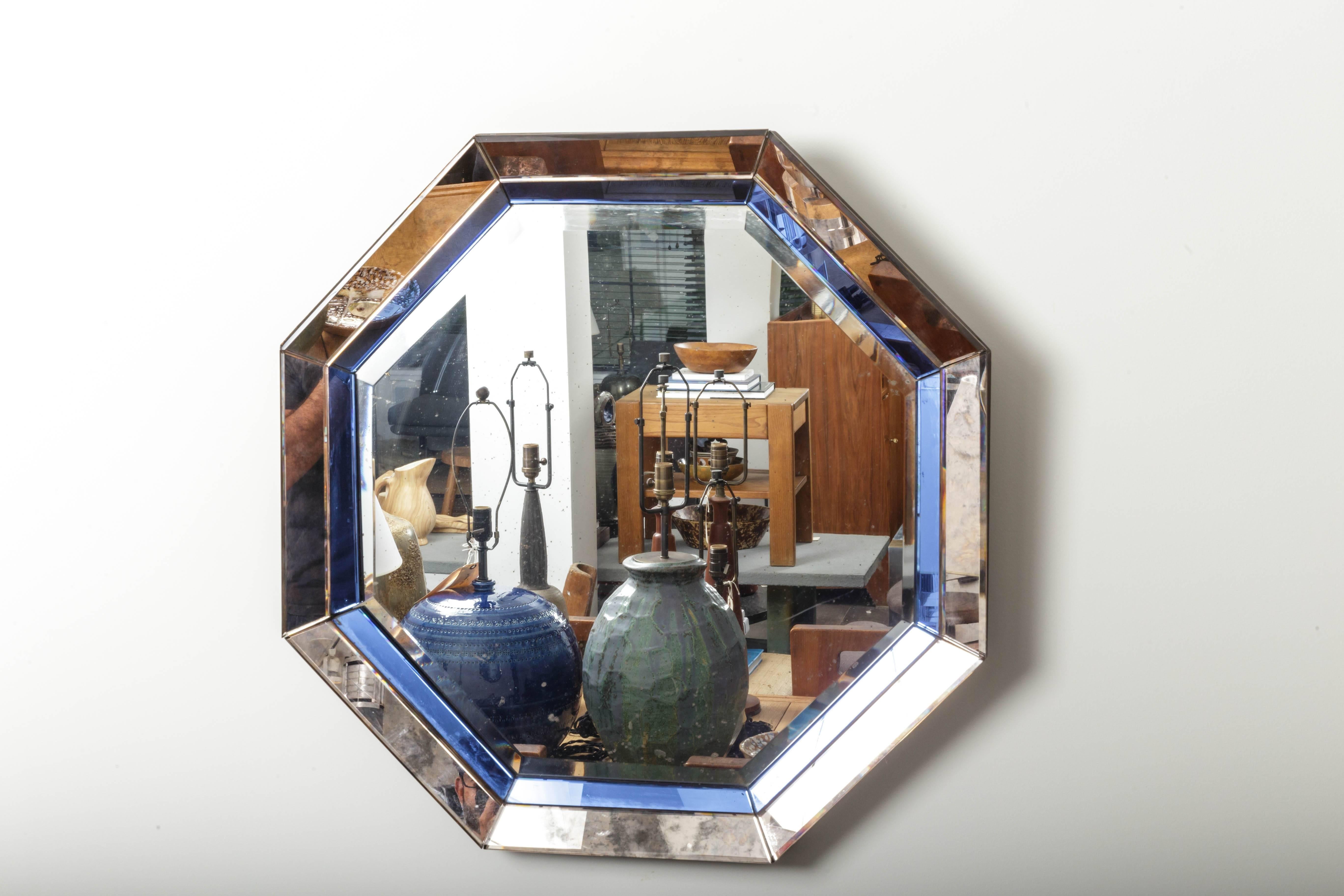 Octagonal mirror with blue and antiqued silver frame
France, 20th century.
  