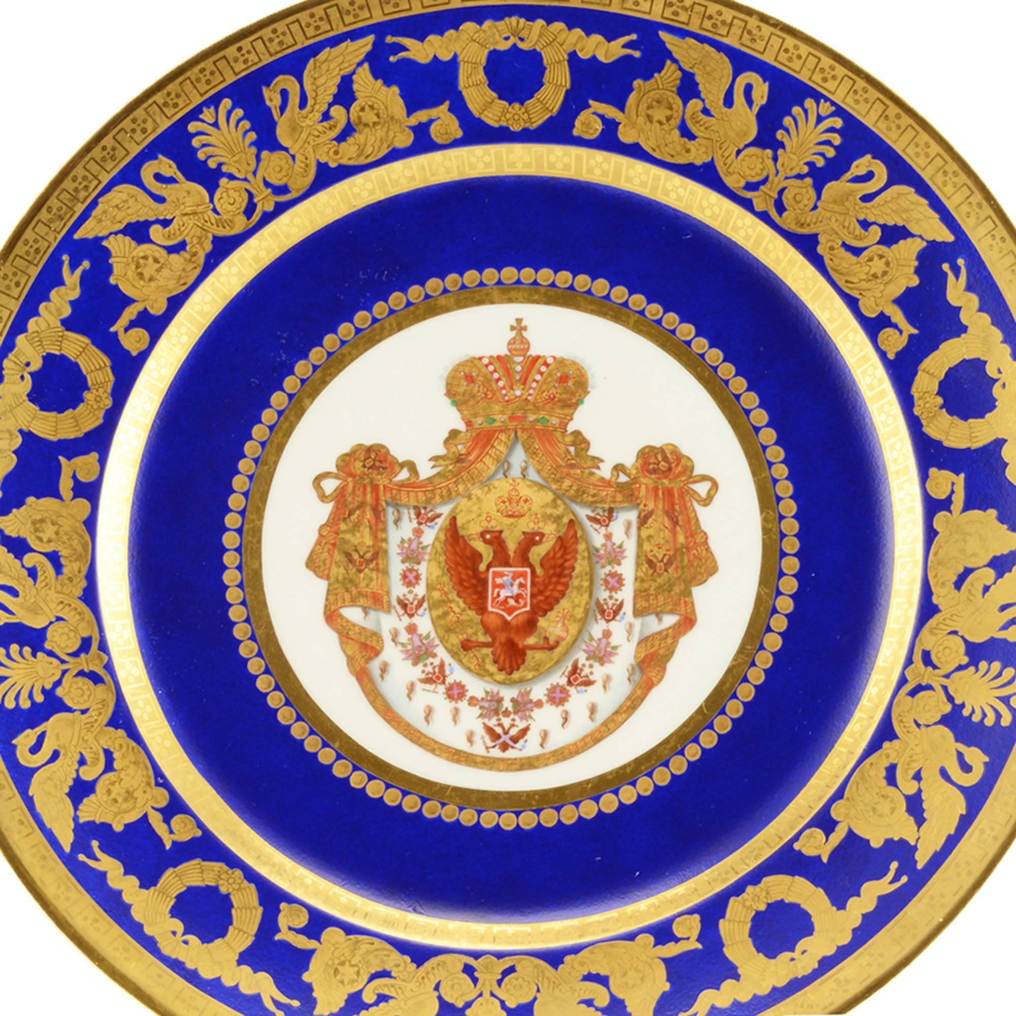 A Russian porcelain dessert plate from the Coronation service of Nicholas I, Imperial porcelain manufactory, period of Nicholas I (1825-1855), 1826. Centered with the Imperial arms including the collar of the Order of St. Andrew on an ermine-lined