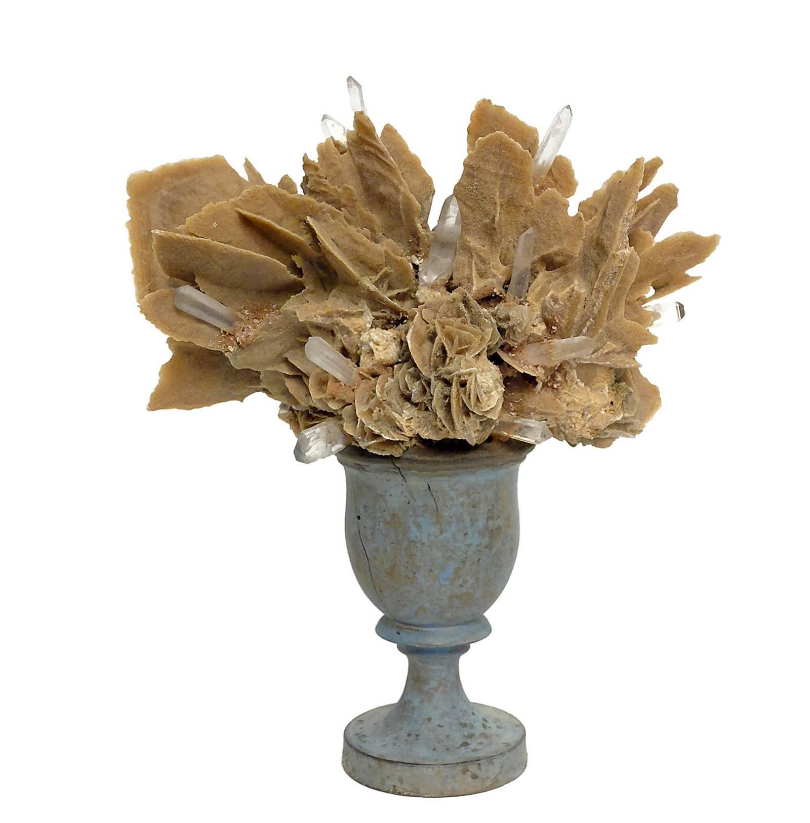 A Naturalia mineral specimen a pair of desert rose crystals and rock crystals, mounted over light blue wooden bases, in a shape of a vases.