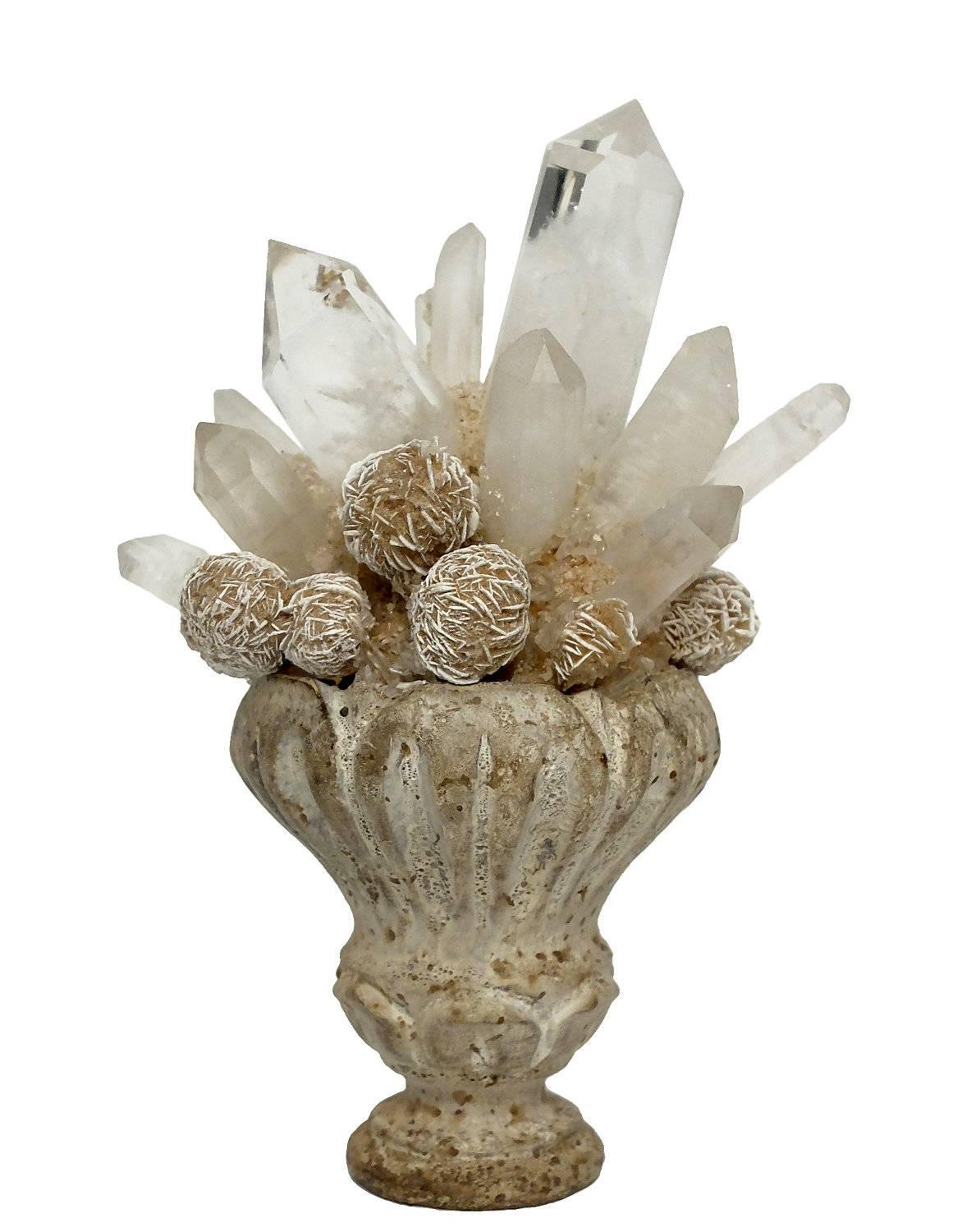 A Naturalia mineral specimen a pair of little Mexican desert rose crystals and rock crystals druzes, mounted over white carved wooden bases.