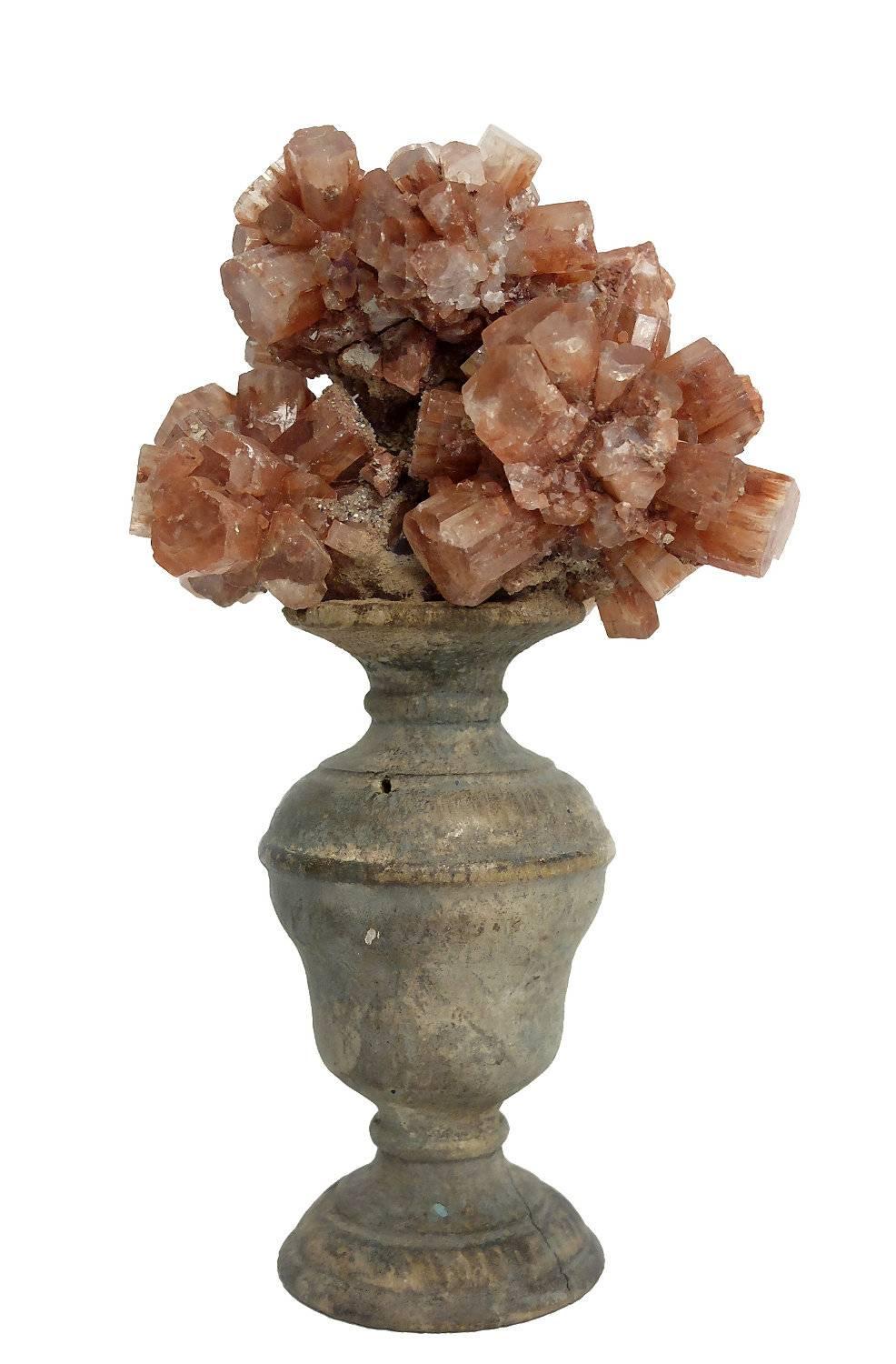 A pair of Naturalia mineral specimens, crystals of Aragonite mounted over a pale wooden bases on a shape of a little vases.