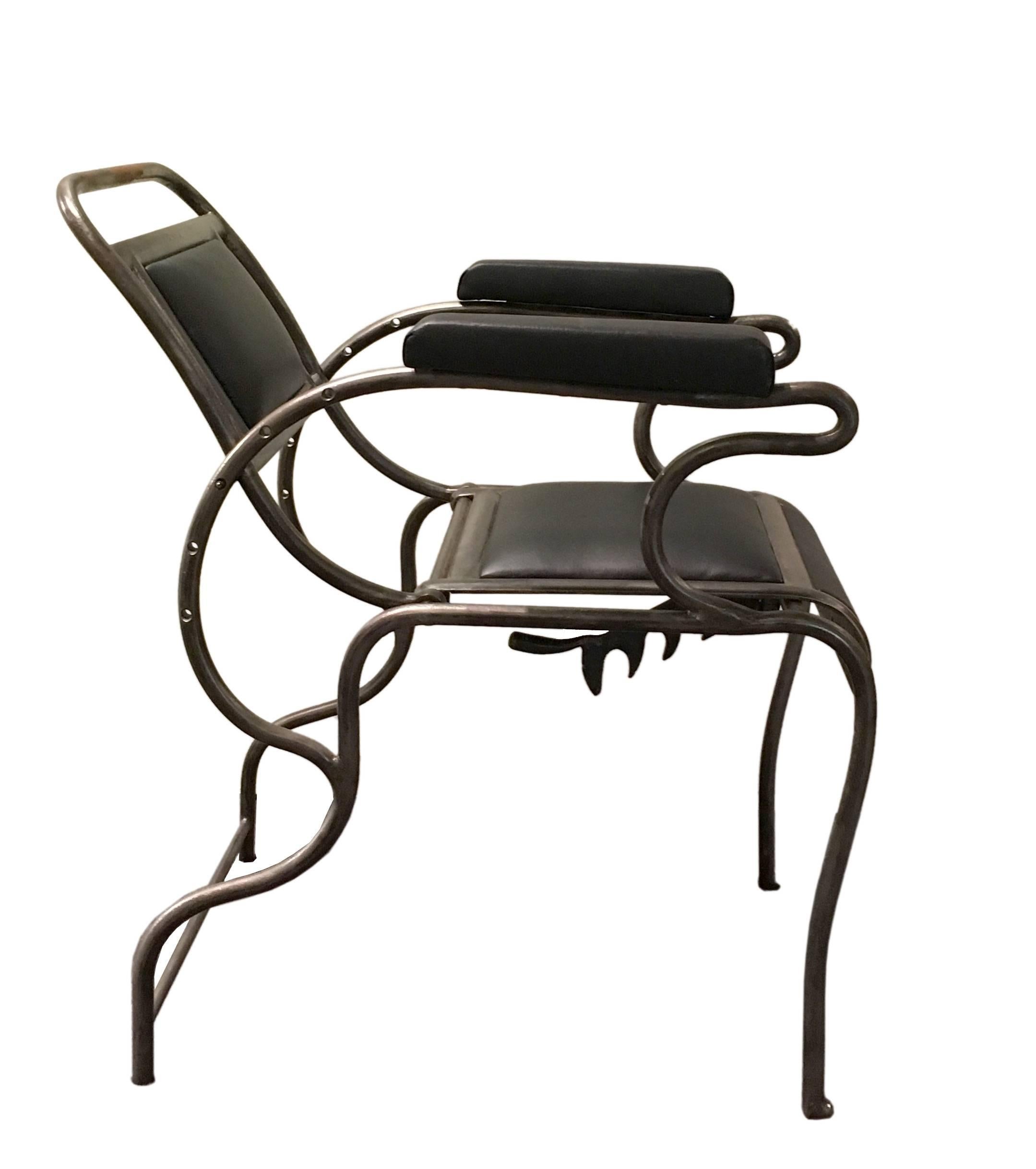 An unusual stainless steel  and black leather dentist’s armchair. A reclining backrest. Produced from A.S.ALOE COMPANY, St. Louis, MO – USA.