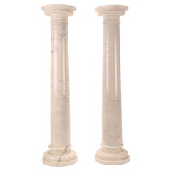 A pair of white Carrara marble columns, Italy 1930s.