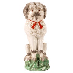 Porcelain sculpture of a Poodle dog, England 1900.