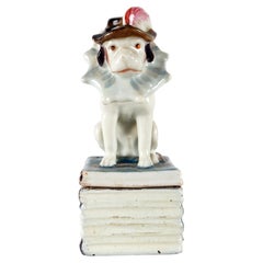 King Charles Cavalier porcelain box, sitting on the books, England 1850.