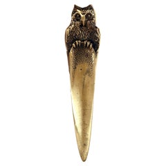 A bronze paper knife opener dipicting a perched owl, Austria 1890.