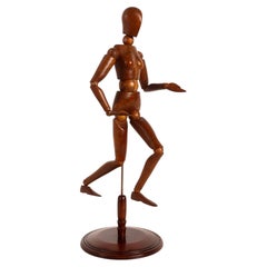 An articulated female artist model, walnut and maple wood, France 1920.