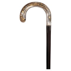 Art Nouveau walking stick, silver guilt knob with leaves, France 1900.