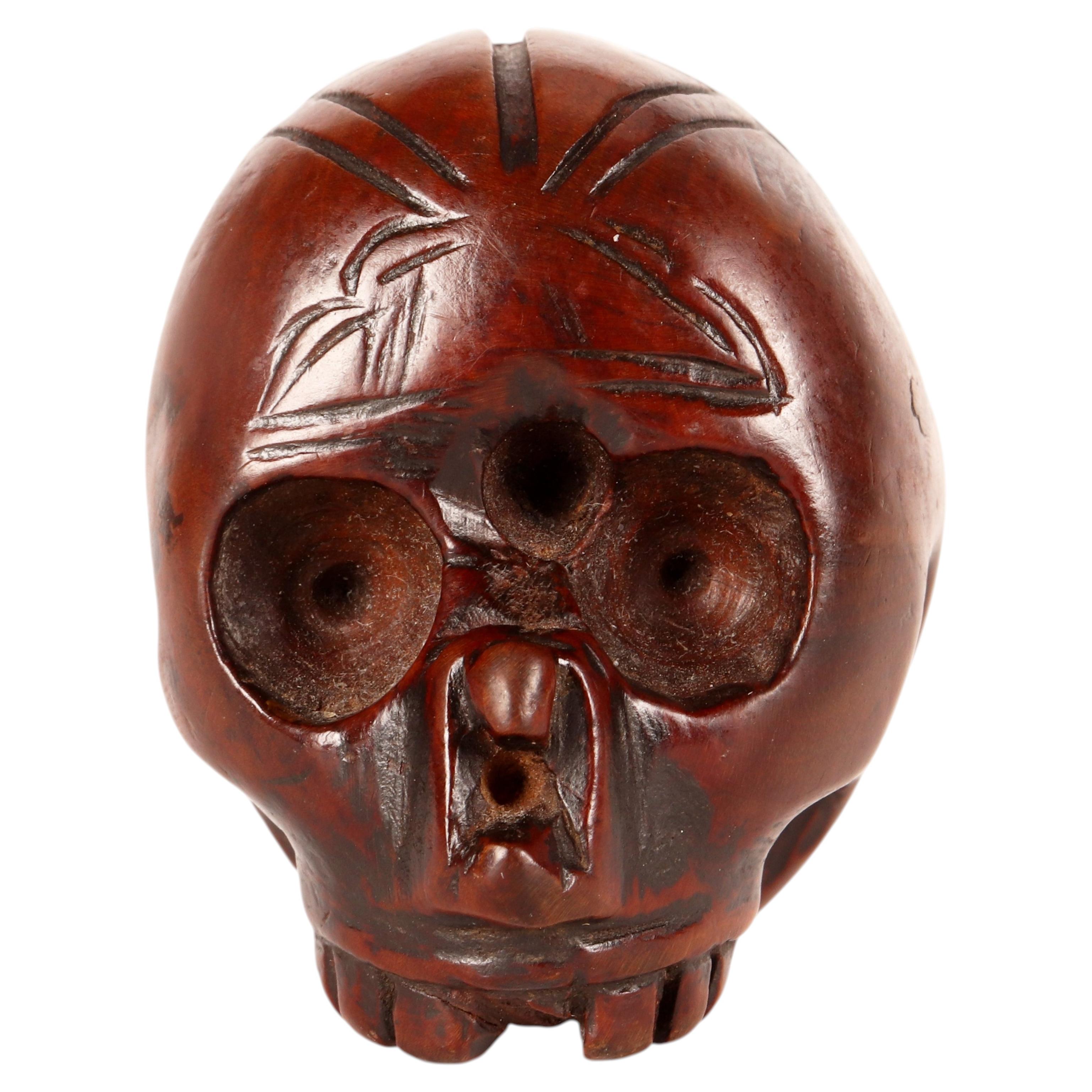 Vanitas in carved and engraved boxwood, in the shape of a skull, Italy 1700. For Sale