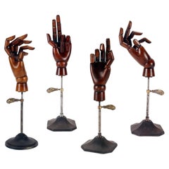 A group of four life-size wooden articulated hands for mannequins. Italy, 1900.
