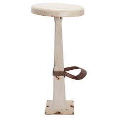 Enamelled metal and brass stool, (Available in sets of four). USA 1930.