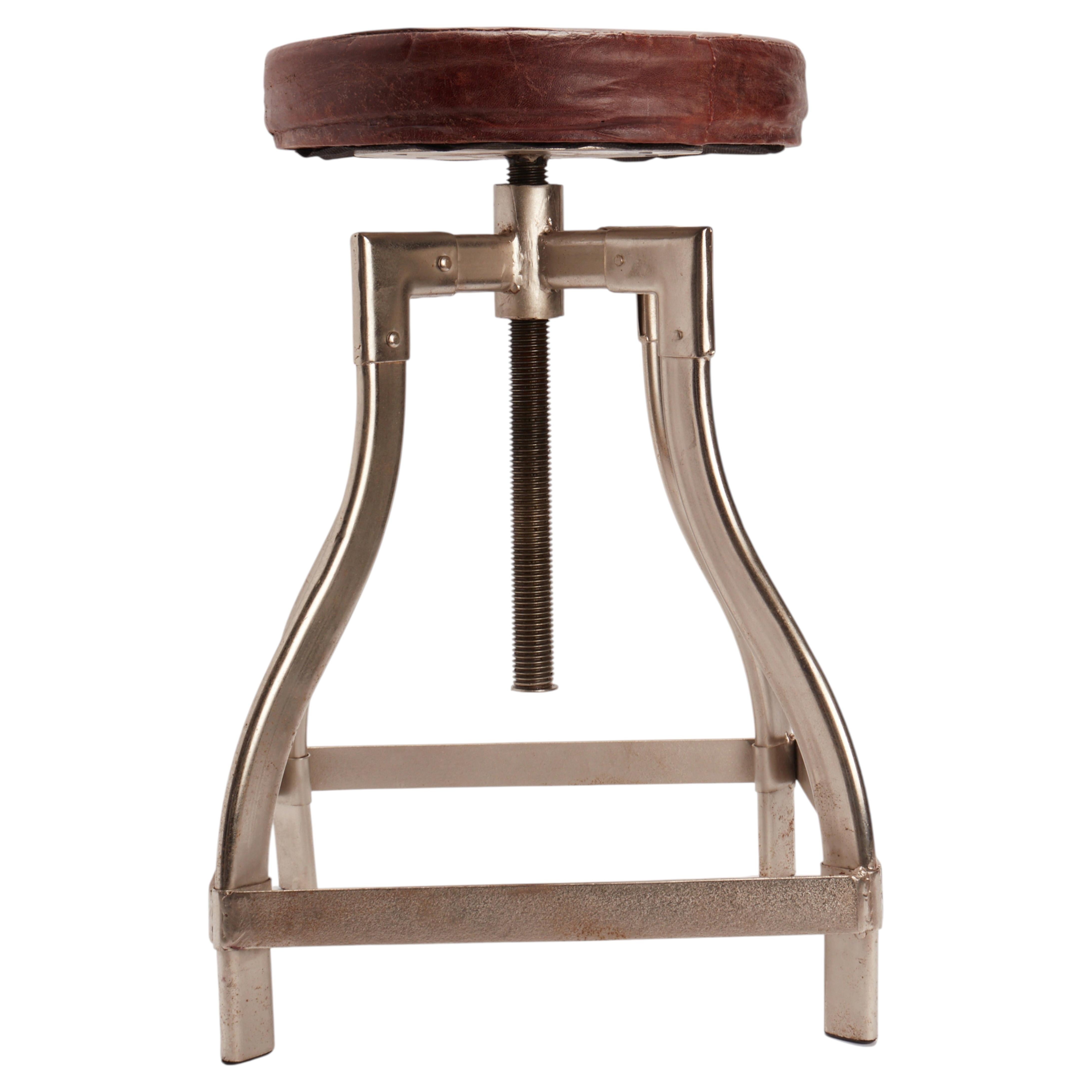 Adjustable chromed metal stool with round leather top, United States 1930. For Sale