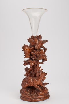 A black forrest wooden sculpture fox and bird with a glass vase, Germany 1880.