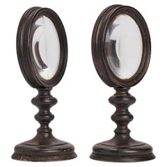 Pair of ebonized wood desk magnifying glasses, Italy 1870.