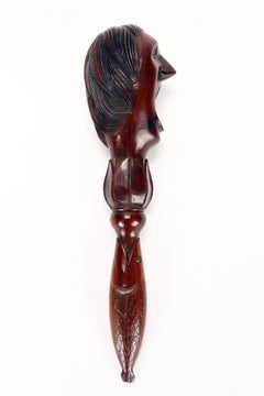 Carved walnut screw nutcracker with grotesque face & fish handle, France c. 1880