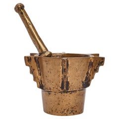 An Italian bronze apothecary mortar with console ribs and pestle – 18th Century.