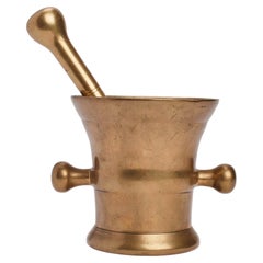 Heavy brass apothecary mortar and pestle with handles, England 19th century.