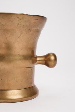 Heavy brass apothecary mortar and pestle with handles, England 19th century.