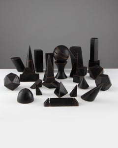 Un conjunto de 26 maquetas de madera ebonizada para uso educativo, Italia, principios del siglo XX.