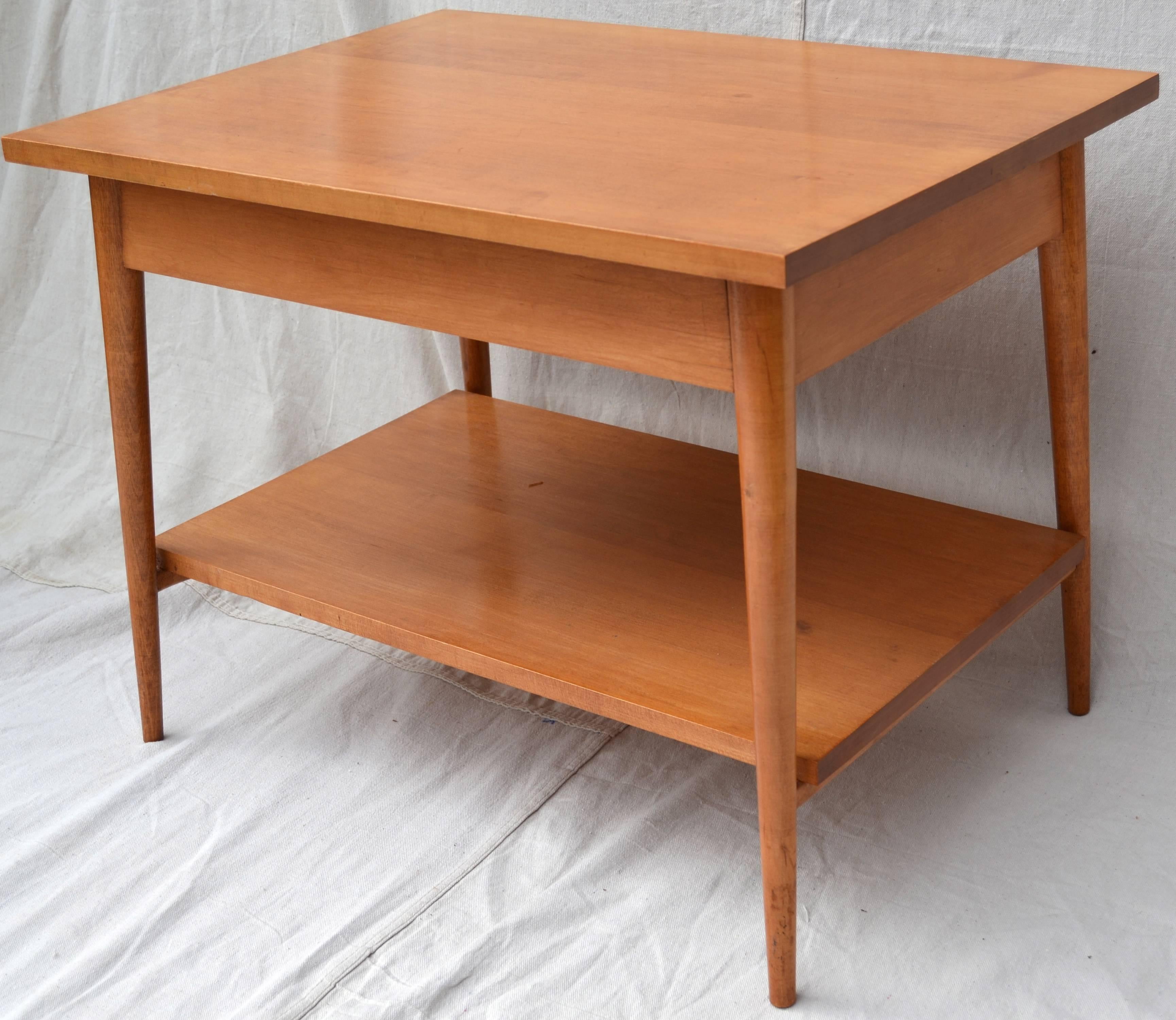 Pair of solid maple Paul McCobb single drawer tables or stands from the Planner Group manufactured by Winchendon. These useful, handsome and sturdy stands are in excellent original finish with the minor use wear. Original brass pulls and labels