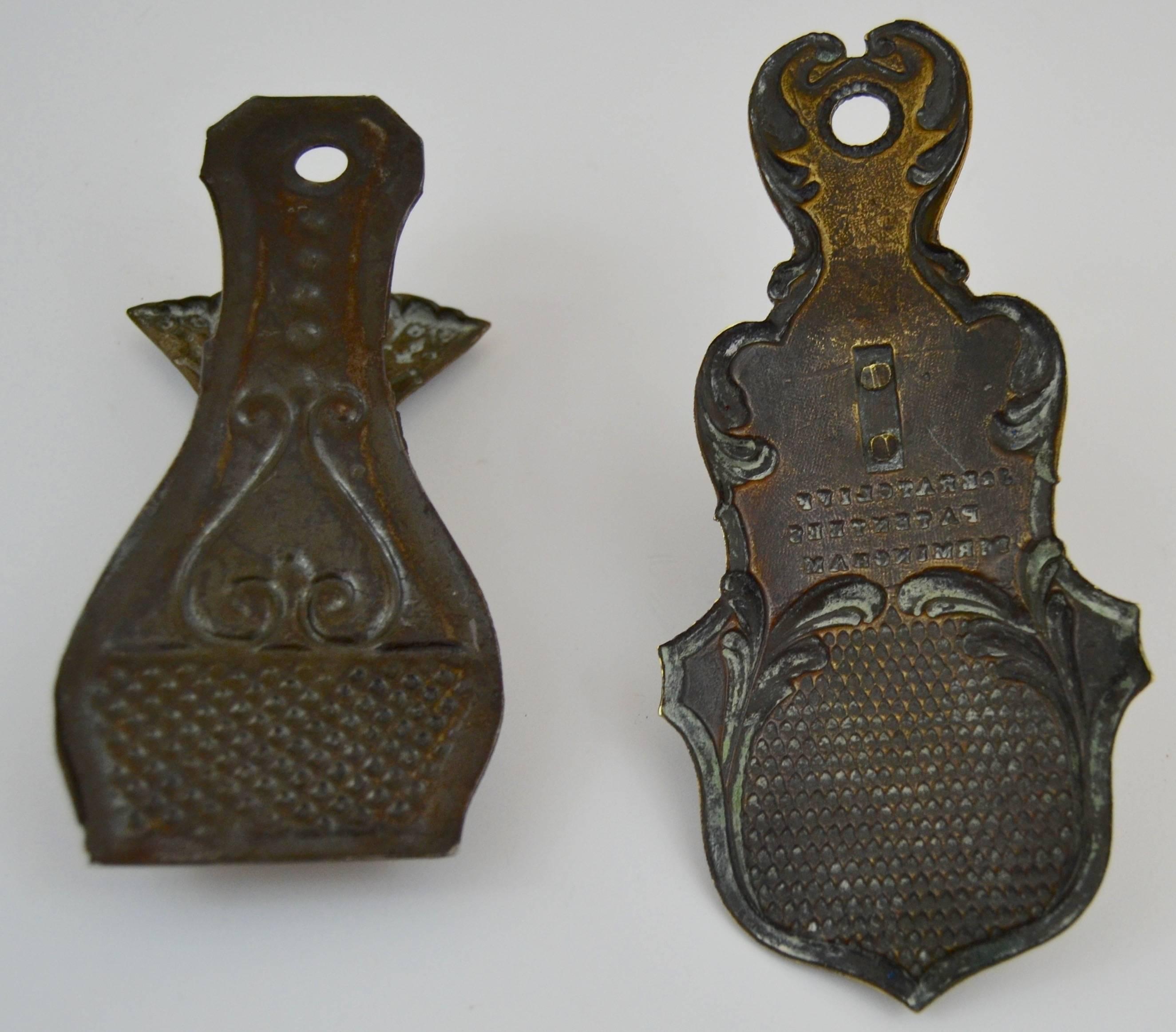 Two Victorian letter clips in the form of hands. Pressed brass, one has a manufactures stamp, J.E. Ratcliff, Birmingham. Spring mechanisms.