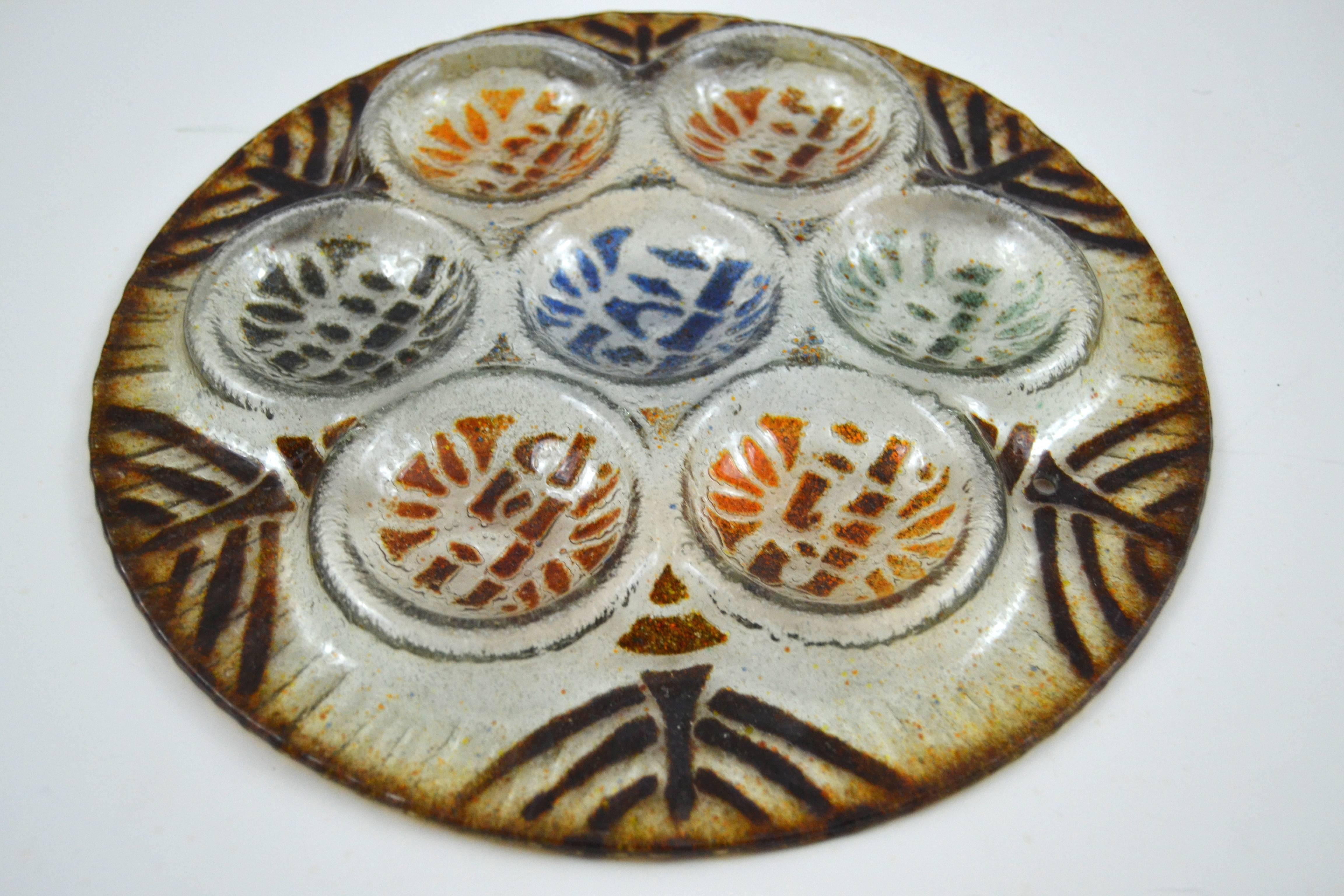 Higgins fused glass seder plate with lovely graphic designs.