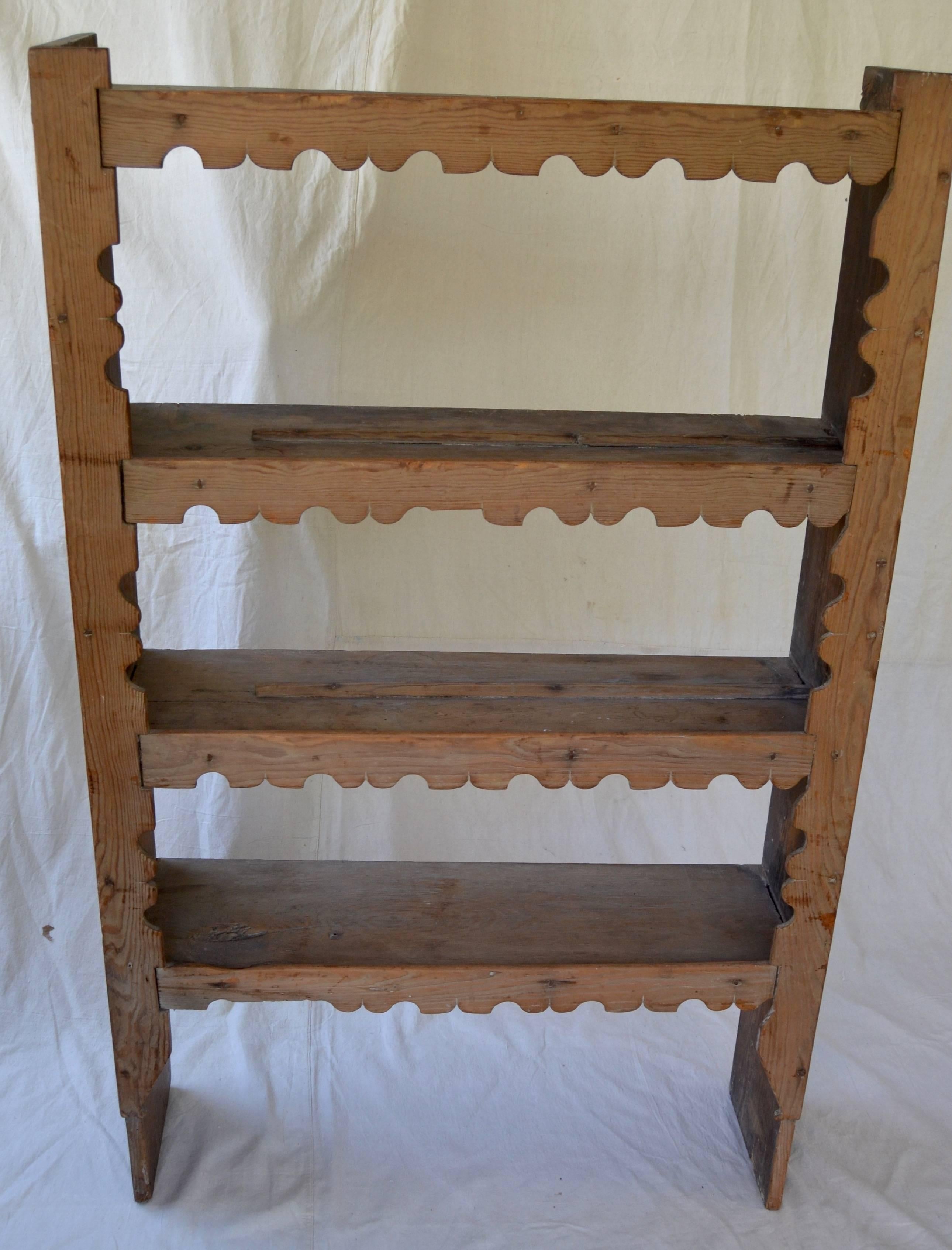 Beautiful pine shelf with decorative cutouts, probably New Mexico. Mortise and Tenon construction. Lovely dry patina surface.