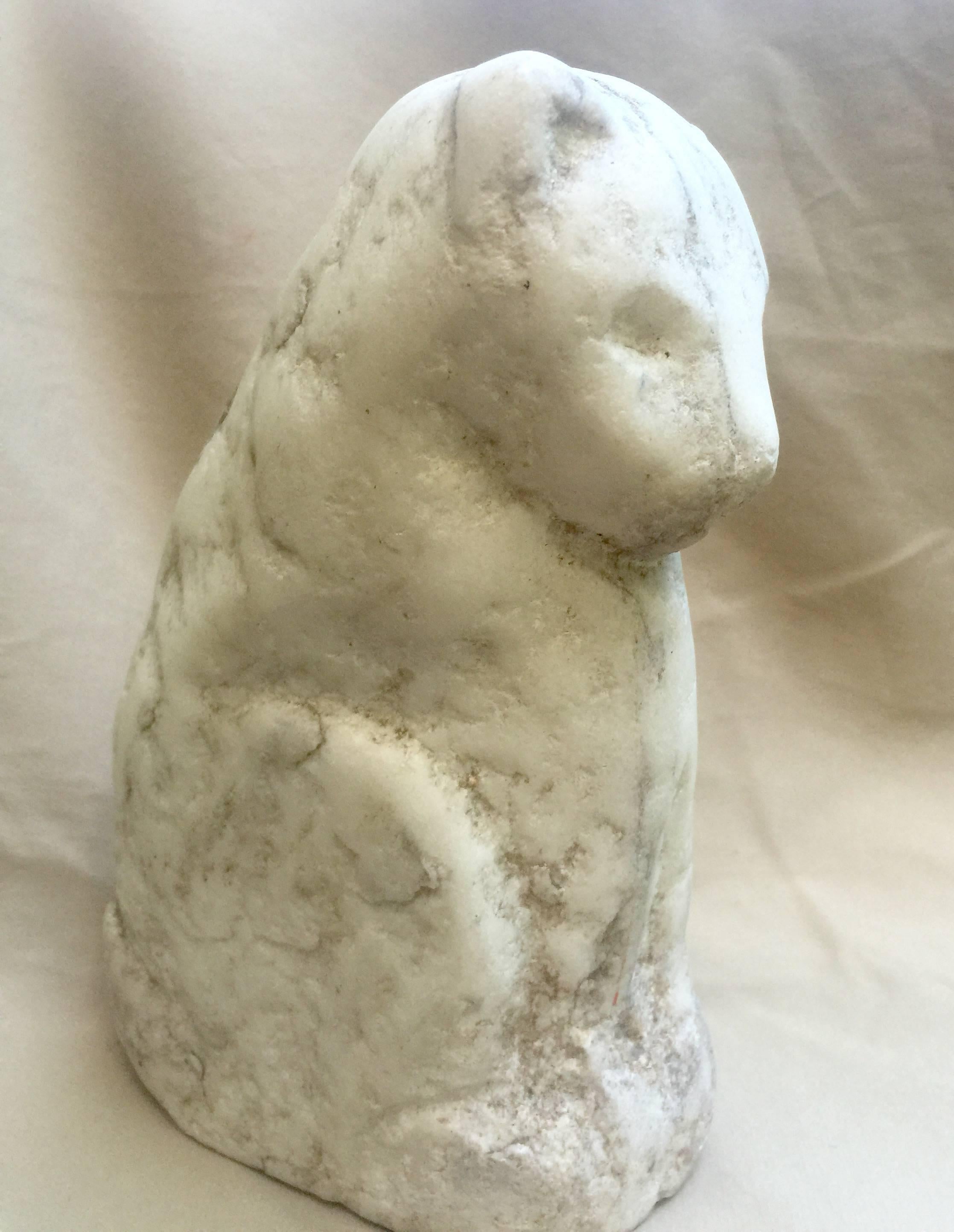 Beautifully conceived small marble carving of a seated cat. Abstracted figure carved from marble with details pared to the essential forms. Found in New England and likely dating to the late 19th-early 20th century.