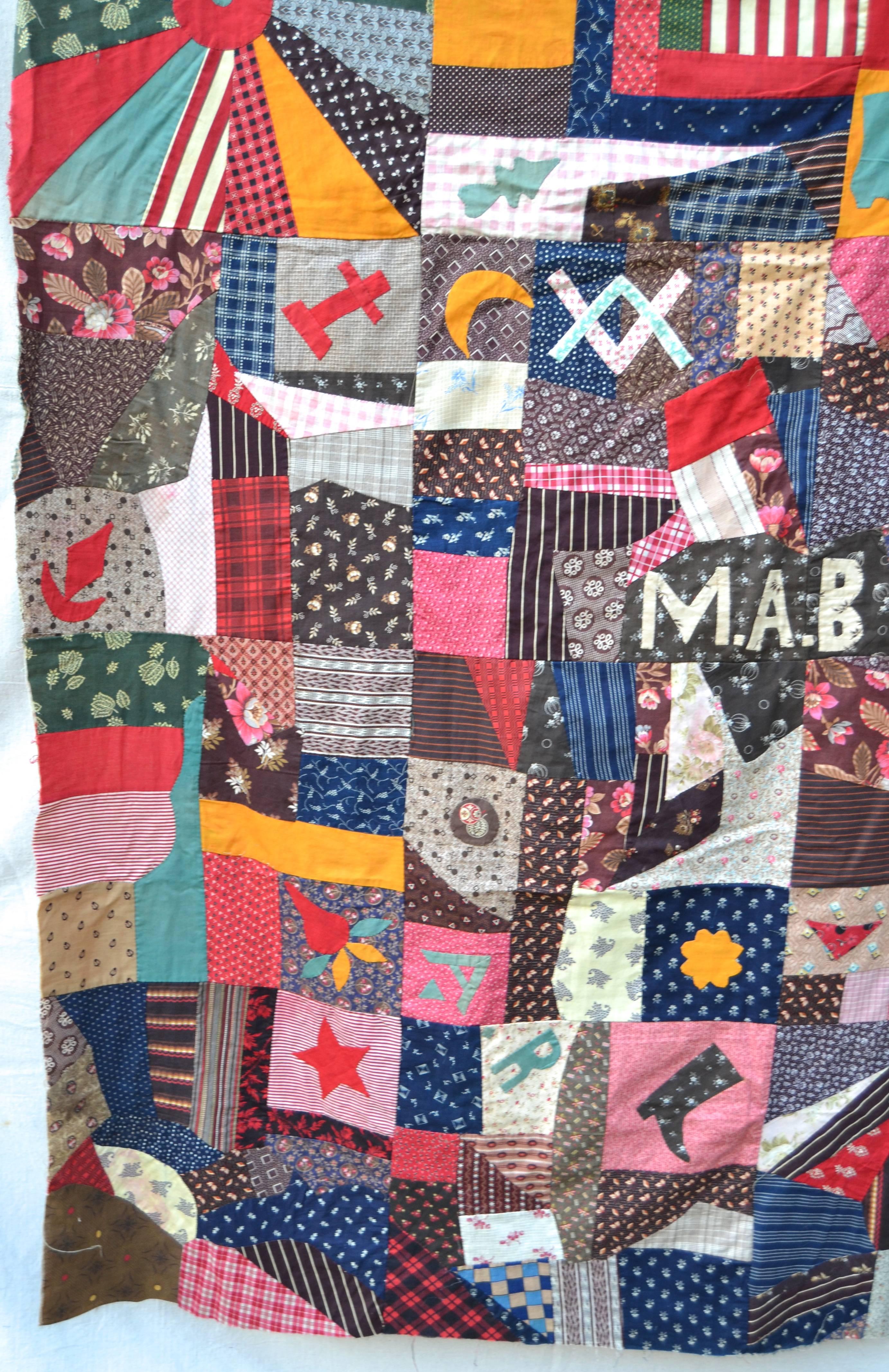 Extraordinary quilt-top with bright and graphic applique images of a hand, hearts, stars, trees of life, boots, flags and abstract patterns. In the centre on a bright red ground are the initials H&M and the date of 1888. There are also broderie