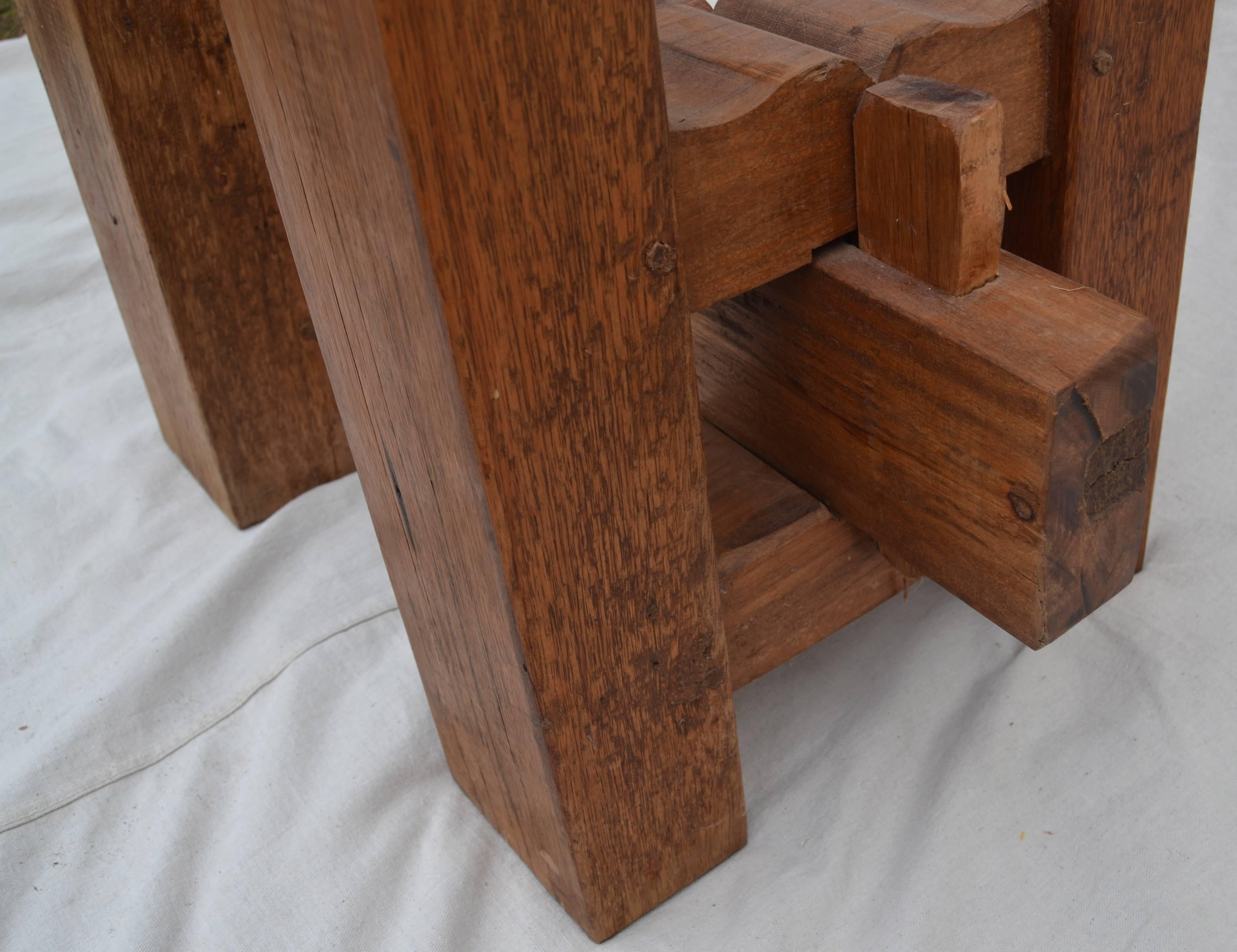 Craftsman made heavy table of large oak slabs constructed with pegs and keys, without glue. The dimensions make it useful as a kitchen table, a small dining table or a sculptural side table. From the Woodstock NY area and typical of the