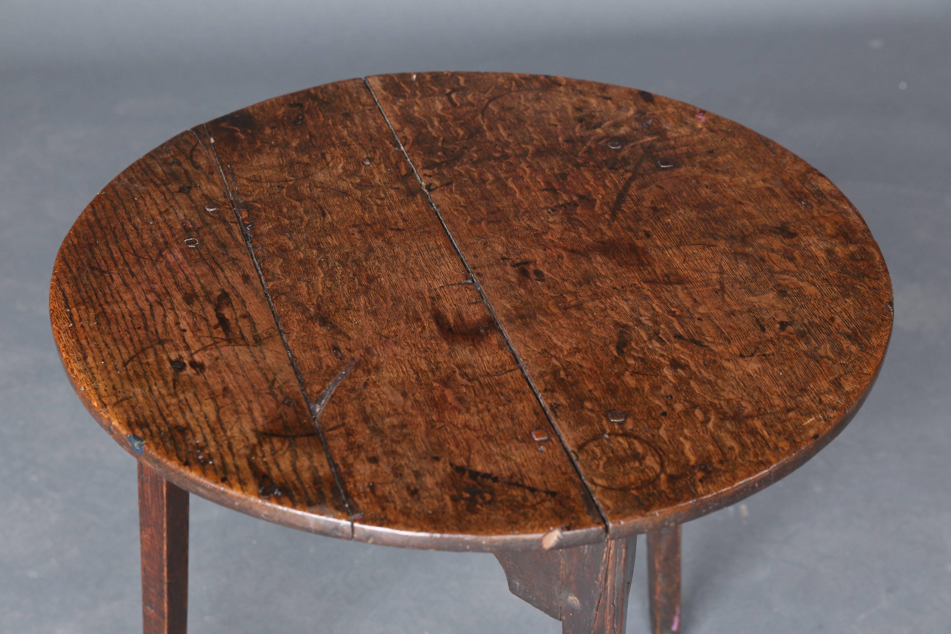 19th century oak table with wooden dowels on the top and legs. Bracketed skirt between the legs. Beautiful patina!
