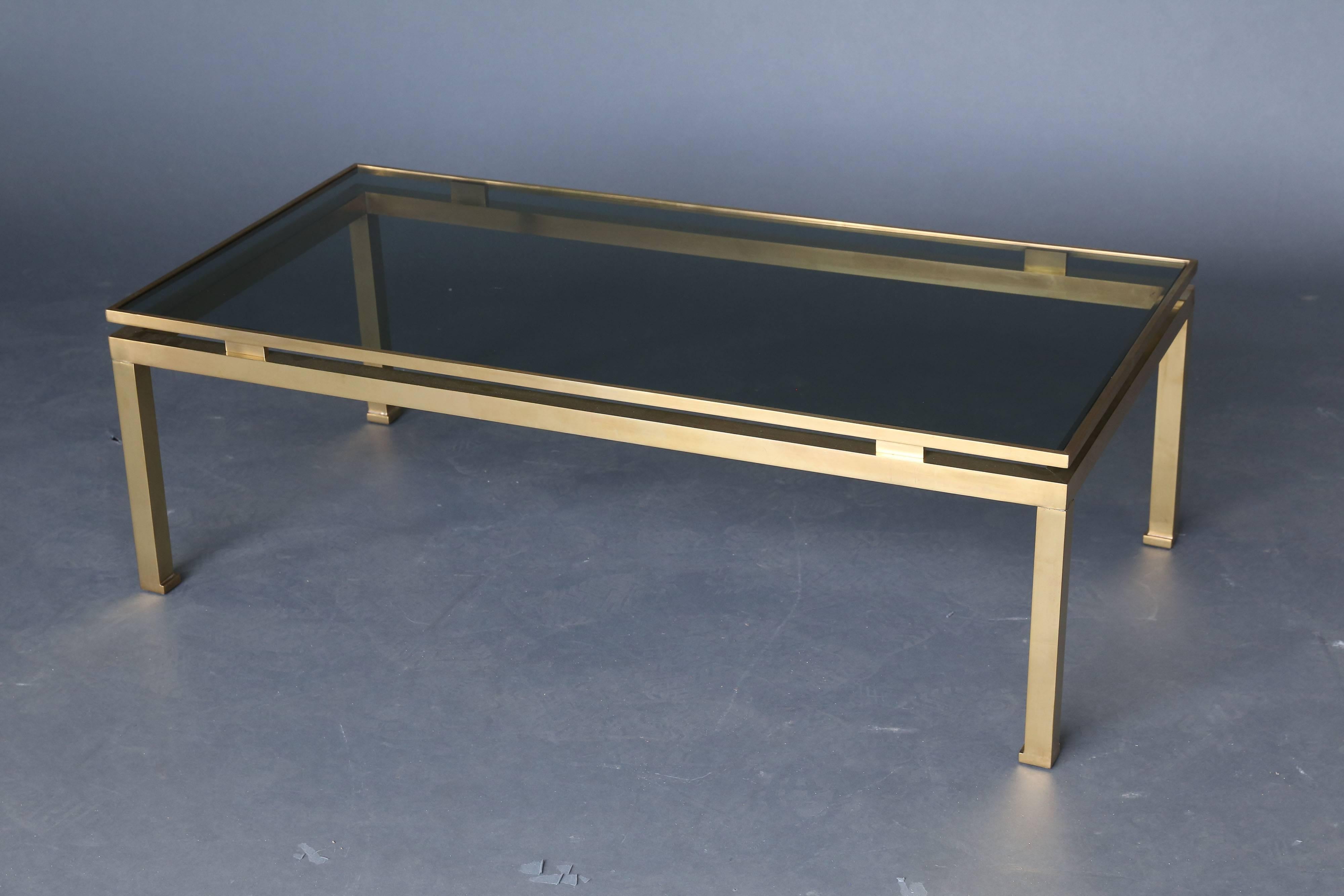 Mid-Century guy Lefevre for Maison Jansen. Brass perimeter and smoked glass top in excellent condition.