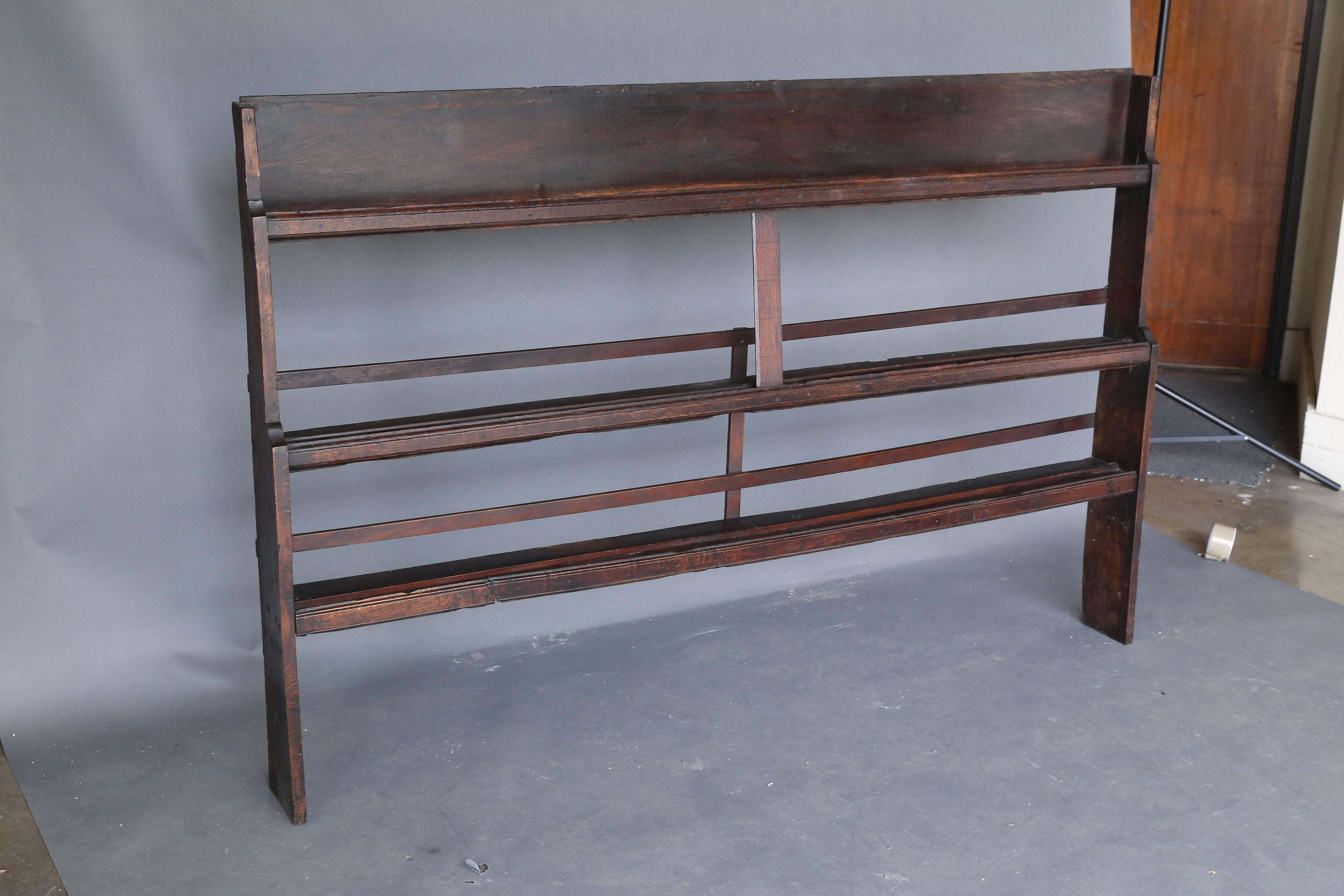 19th century three-tiered plate rack used on top of a piece of furniture or can be attached to a wall.