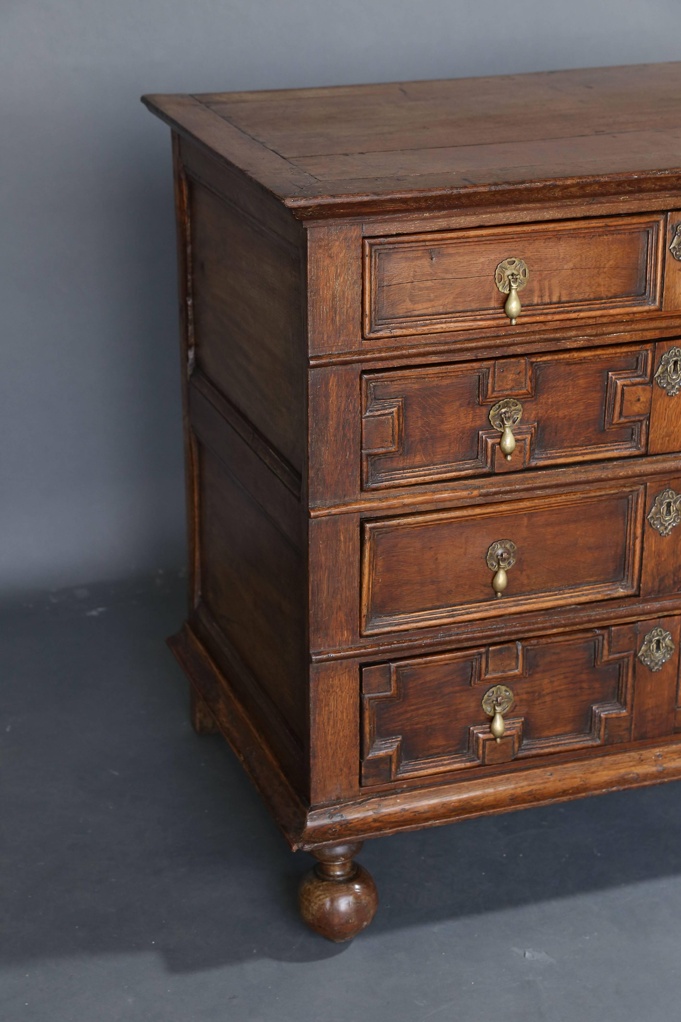 17th century Jacobean chest with four drawers. Period hardware and beautiful patina. Formerly in a dealer's home. Walnut details and oak throughout drawers.