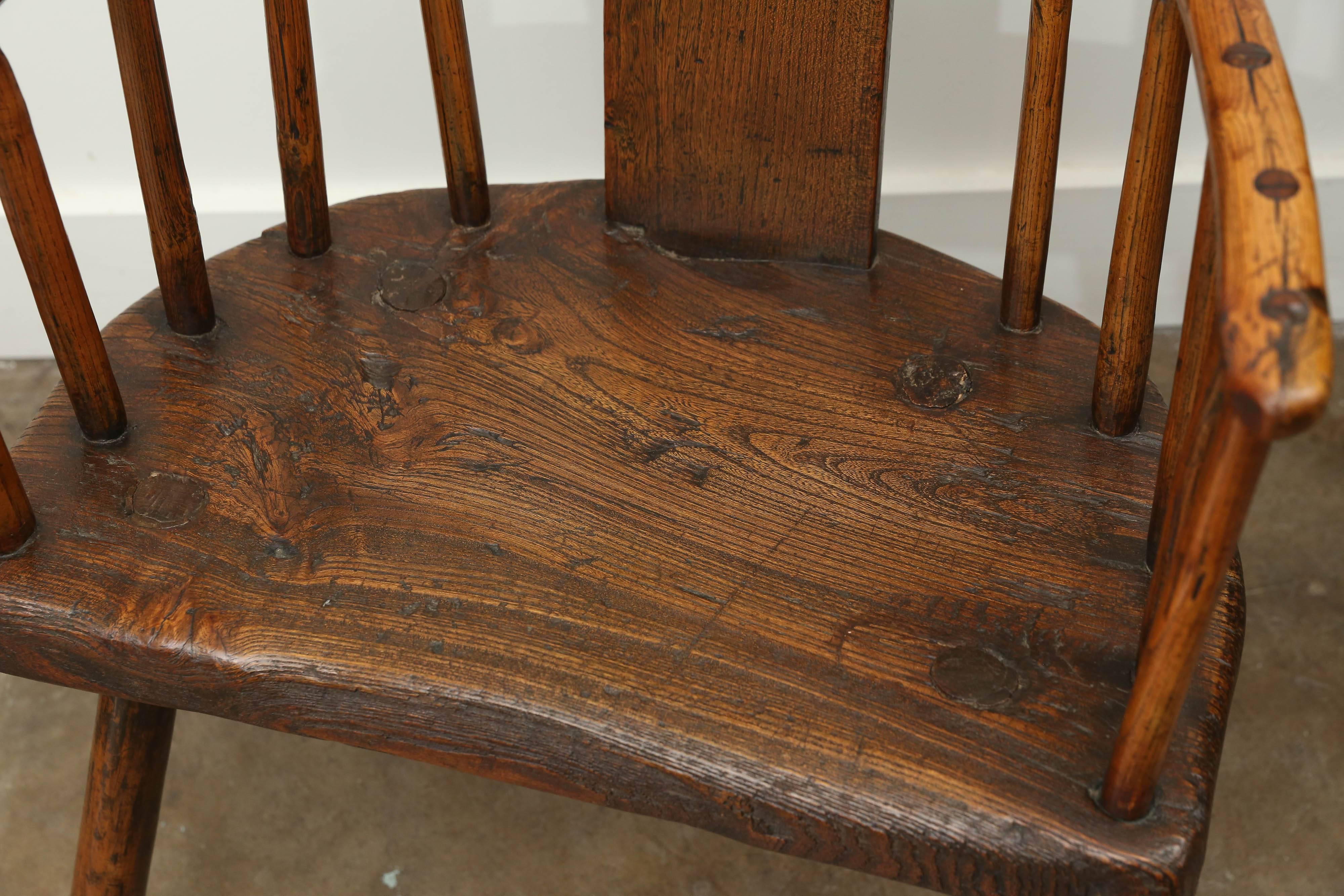 18th Century Welsh country folk art chair in elm. Beautiful patina, wonderful workmanship and remarkably comfortable. Very sturdy. This chair alone can provide wonderful atmosphere in a room.