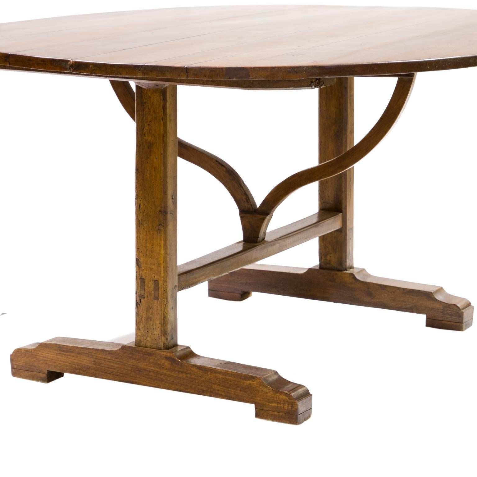 A fantastic oval wine tasting table with flip-top and turnstile support. Great color and patina. Very sturdy. This piece is french Provincial, made of cherrywood, planked top and size is large enough for a breakfast room, early 19th century.
    