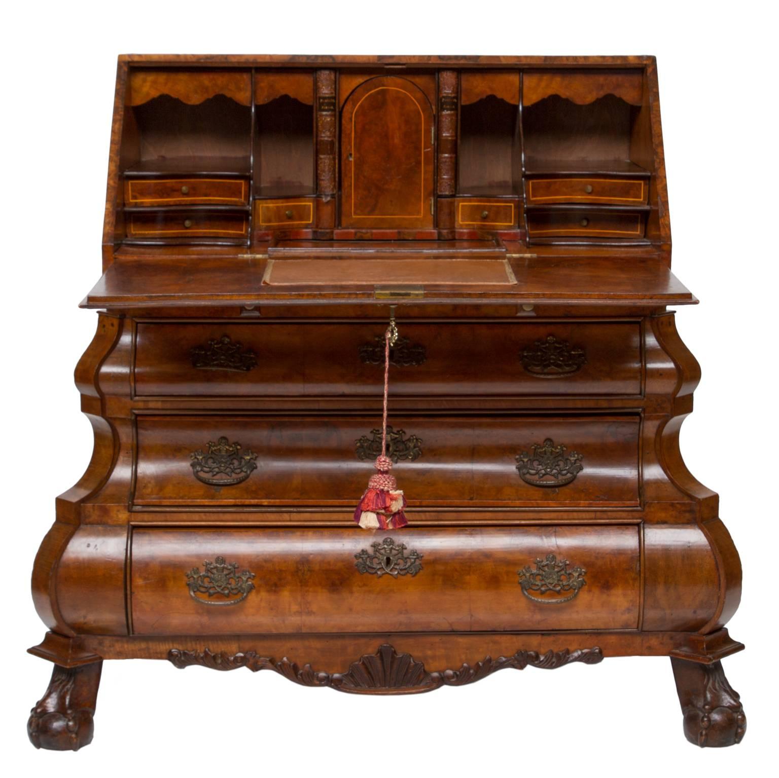 19th century Dutch bombè bureau
Here is a very clean 19th century bureau with fitted interior, Graceful bombé shaped front, decorated hardware, beautiful burl walnut front and straight walnut grain walnut side, hand-carved apron and bracket feet in
